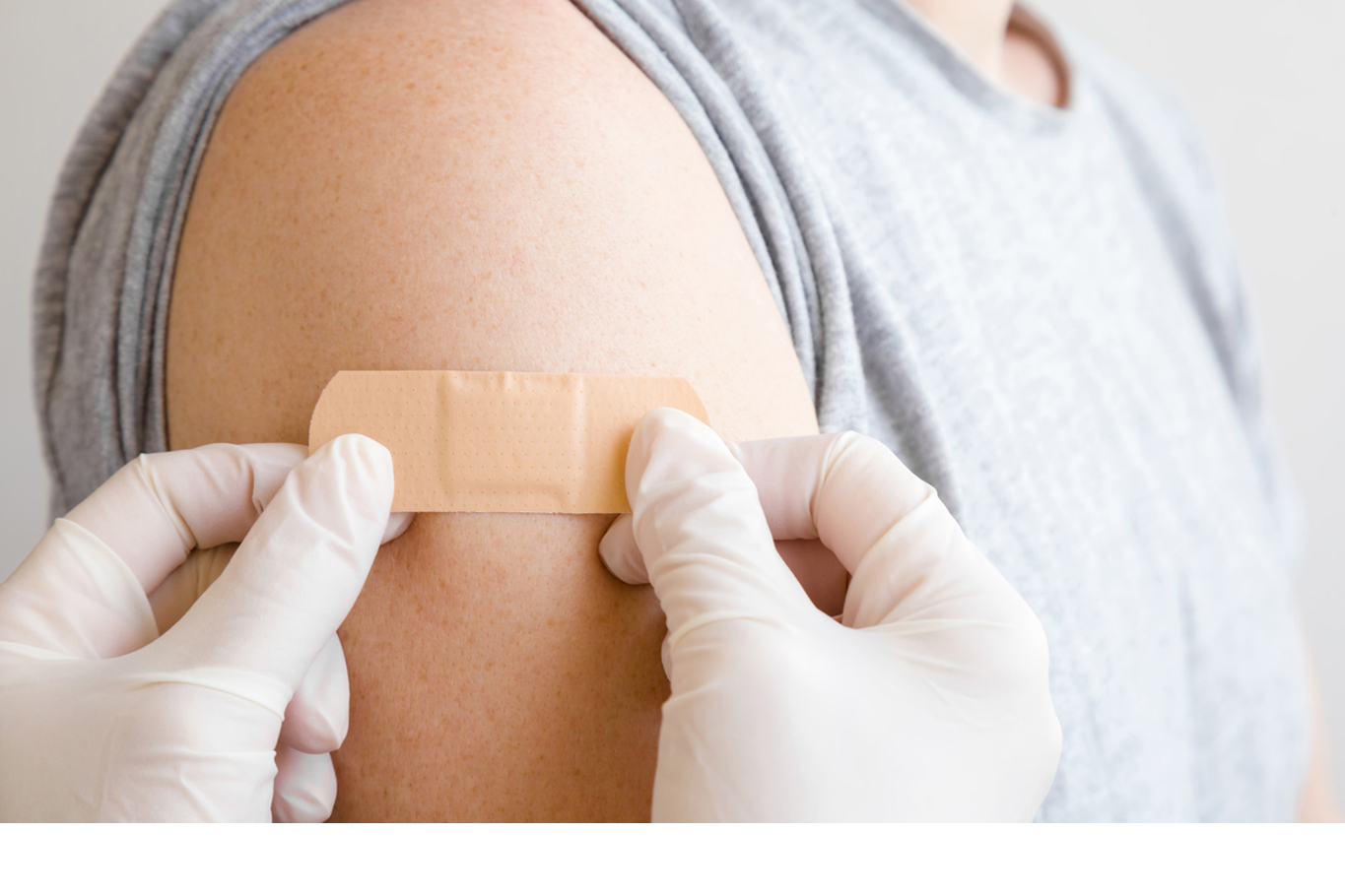 Close up of woman having a vaccination with a needle