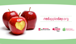 Three red apples, once with bites taken out in the shape of a heart advertising red apple day org